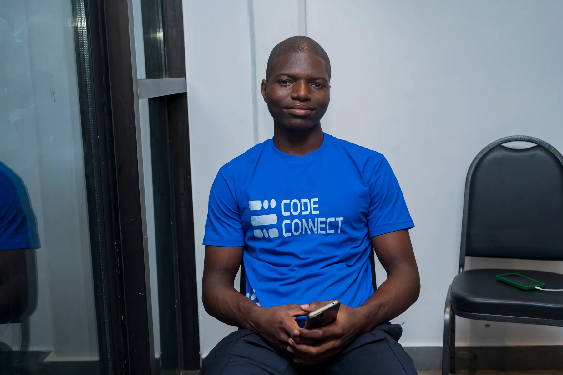Portrait of a volunteer wearing a CodeConnect shirt